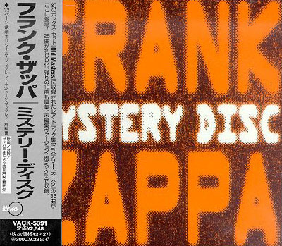 The Japanese MYSTERY DISC with obi on the left. The obi says, of course, "FRANK ZAPPA / MYSTERY DISC"